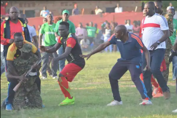 Football Players Seize Gun From Soldier Who Wanted To Shoot During Match... Photos